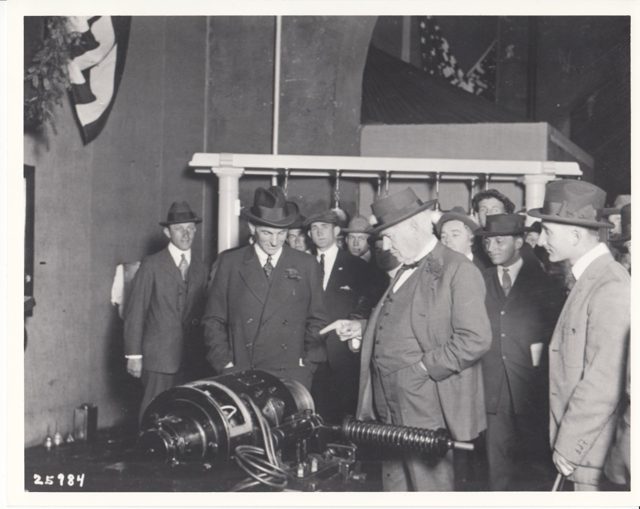 Thomas Edison and Henry Ford with others at a machinery exhibit
