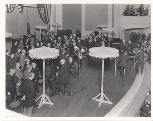 Thomas Edison on stage receiving an award