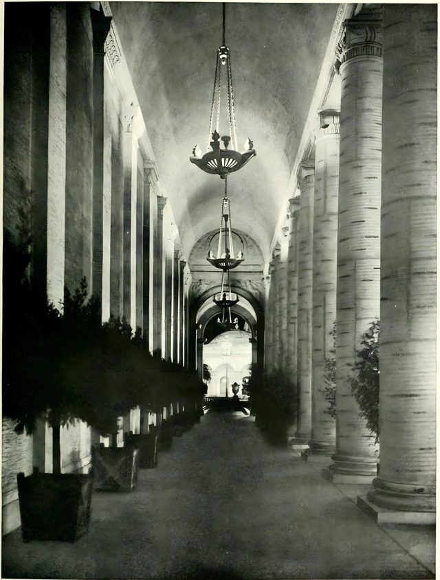 A lighted corridor in the Court of Palms