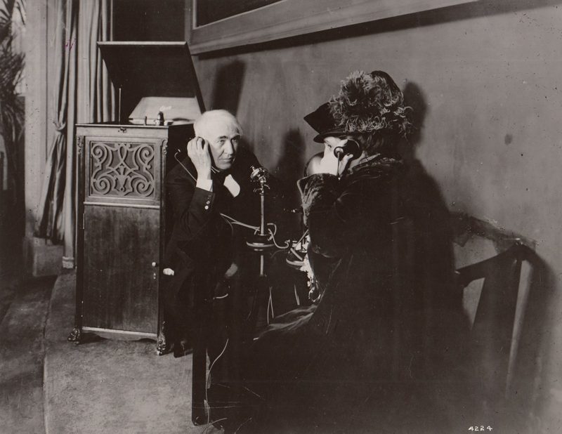 Thomas and Mina Edison in the Palace of Liberal Arts, listening by telephone to a phonograph playing in West Orange, New Jersey